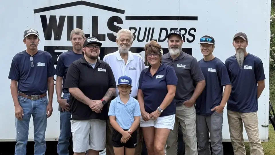 Wills Builders team in company shirts in front of the white Wills Builders trailer, home remodeling Warren PA
